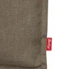 A close-up view of a fabric texture with a red tag attached to the side. Produktbild-Vorschau