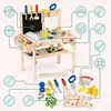 A wooden toy workbench with various tools and accessories, highlighted with connecting lines and icons. Náhled obrázku produktu