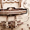 A close-up view of a wooden 3D puzzle, showing intricate gears and strings. Produktbild-Vorschau