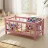 Ein hölzernes Puppenbett in Rosa mit Bettwäsche im Produktbild-Vorschau 6