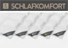 Several white duvets are lined up diagonally, each with a different colored tag indicating its type. Produktbild-Vorschau