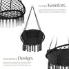 A black hanging chair with tassels is shown from multiple angles, with descriptive text highlighting its comfort and design. Náhled obrázku produktu