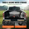 A black water storage bladder is placed in the bed of a white pickup truck, parked outdoors in a grassy, hilly area. Náhľad obrázku produktu