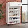 A white shoe cabinet with multiple shelves filled with shoes, placed against a brick wall. Anteprima dell’immagine prodotto