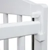 Close-up of a white crib railing with a white plastic connector mechanism. Produktbild-Vorschau