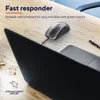 A wired computer mouse is placed on a wooden desk next to a laptop. Anteprima dell’immagine prodotto