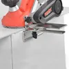 A close-up view of an electric planer with a fence attachment, positioned on the edge of a white surface. Produktbild-Vorschau
