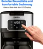 A close-up shot of a Medion coffee maker's control panel with a hand pressing a button. Produktbild-Vorschau