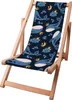 A wooden beach chair with a fabric seat featuring a pattern of whales, moons, and clouds. Náhled obrázku produktu