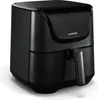 A black air fryer is shown from a three-quarter angle against a white background. Náhľad obrázku produktu