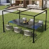 An outdoor dining set with a pergola structure in a grassy backyard. Náhled obrázku produktu
