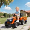 A young boy is happily riding an orange toy tractor with a trailer in a sunny backyard. Náhľad obrázku produktu