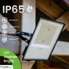 A black LED floodlight is mounted on a wooden beam, with rain falling in the background. Text overlays highlight features like IP65 rating, sun-proof, waterproof, snow-proof, and durable. Voir les images du produit