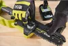 Hands wearing gloves are adjusting a small electric chainsaw. Produktbild-Vorschau