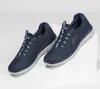 A pair of navy blue Skechers sneakers are displayed on a white surface. Produktbild-Vorschau