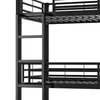 A close-up view of a black metal bunk bed frame, showing the ladder and part of the upper and lower bed frames. Produktbild-Vorschau