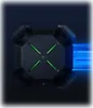 A top-down view of a black Xiaomi router with green accents, set against a dark background with blue light streaks indicating speed. Podgląd zdjęcia produktu