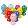 A collection of colorful wooden fish toys arranged in a semi-circle. Náhled obrázku produktu