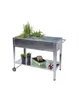 A raised garden bed with plants and gardening supplies on a white background. Produktbild-Vorschau
