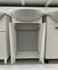 A white bathroom vanity with an open cabinet and a sink on top, displayed in a retail setting. Anteprima dell’immagine prodotto