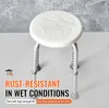 A white shower stool with adjustable legs is shown against a textured gray background. Text overlays highlight its rust-resistant properties. Podgląd zdjęcia produktu