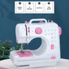 A white and pink sewing machine is displayed against a blue brick-like background, with a plant to the left. Above the sewing machine, there are four boxes with checkmarks and text describing features. Náhled obrázku produktu