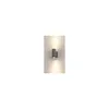 A gray cylindrical wall light fixture mounted on a white wall, emitting light upwards and downwards. Produktbild-Vorschau