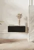 A modern bedroom setting with a floating nightstand against a textured wall. Produktbild-Vorschau