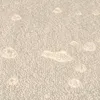 Close-up of water droplets on a textured surface, likely a drying mat. Náhľad obrázku produktu