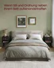 A bedroom scene with a bed, nightstands, and artwork on the wall. Produktbild-Vorschau