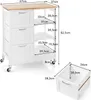 A diagram showing the dimensions of a kitchen cart and a storage bin. Voir les images du produit