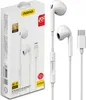A product shot of white in-ear headphones and their packaging. Produktbild-Vorschau