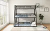 A triple bunk bed with mattresses in a room with large windows and a plant. Podgląd zdjęcia produktu