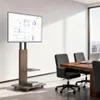 A modern conference room with a TV stand and screen, chairs, and a table. Anteprima dell’immagine prodotto