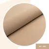 A close-up shot of a beige fabric panel, folded to show its texture and thickness. The panel is inside a white circle, with a light beige background. Anteprima dell’immagine prodotto