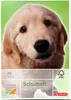 A close-up of a golden retriever puppy on a notebook cover. Produktbild-Vorschau