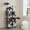A multi-level cat tree with several cats interacting with it, placed in a room with a window and a cat litter box. Produktbild-Vorschau