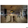 A modern dining room with a concrete ceiling, wooden table and chairs, and a unique circular shelving unit. Produktbild-Vorschau