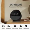 An Amazon Echo Spot sits on a nightstand next to a bed, displaying the time and temperature. Below the product are icons representing features. Produktbild-Vorschau