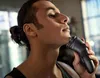 A man is shaving his beard with an electric shaver. Podgląd zdjęcia produktu