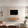 A modern living room with a TV mounted on the wall, a floating media console, and a sectional sofa. Produktbild-Vorschau