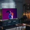 A modern living room setup featuring a large television displaying vibrant content, with decorative elements and furniture. Produktbild-Vorschau