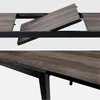 Close-up view of a table's extension mechanism and frame. Anteprima dell’immagine prodotto