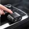 A hand is pressing a button on a car's center console, with a black car charger splitter in the foreground. Produktbild-Vorschau