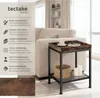 A side table in a living room setting, next to a sofa. Produktbild-Vorschau