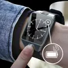 A person's wrist wearing a smartwatch, with a close-up inset showing a battery icon and a muscular arm icon. Produktbild-Vorschau