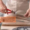 A person is using glass running pliers to cut a piece of glass, with a ruler and other glass pieces in the background. Produktbild-Vorschau