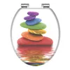 A toilet seat lid with a colorful stacked stones design. Náhled obrázku produktu