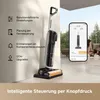 A wet and dry vacuum cleaner is shown next to a smartphone displaying its app interface, with a woman and a dog in the background. Produktbild-Vorschau