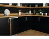 A corner of a kitchen with black cabinets and wooden countertops and shelves. Náhľad obrázku produktu
